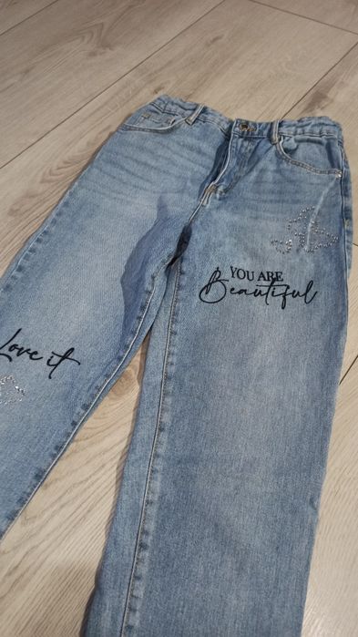 Spodnie jeansy 40 zł para 152