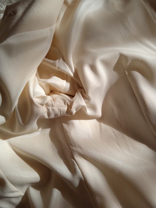 Жіноче пальто молочне