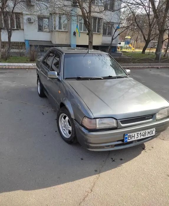 Передний бампер Mazda 323 BF