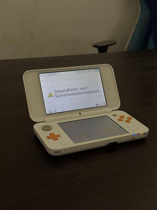 New Nintendo 2DS XL biała-pomarańczowa + ładowarka