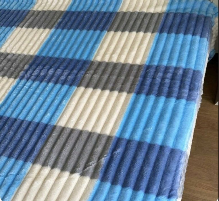 Теплі пледи на штучний овчині