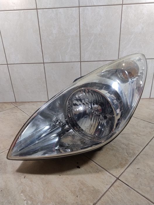 Hyundai i20 lampa reflektor lewy przód 08-12 Europa wysyłka oryginał