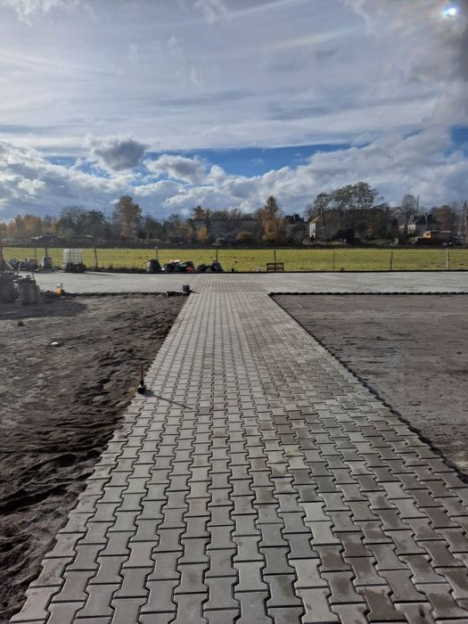 Brukarstwo przemysłowe układanie maszynowe układarka  leveller system