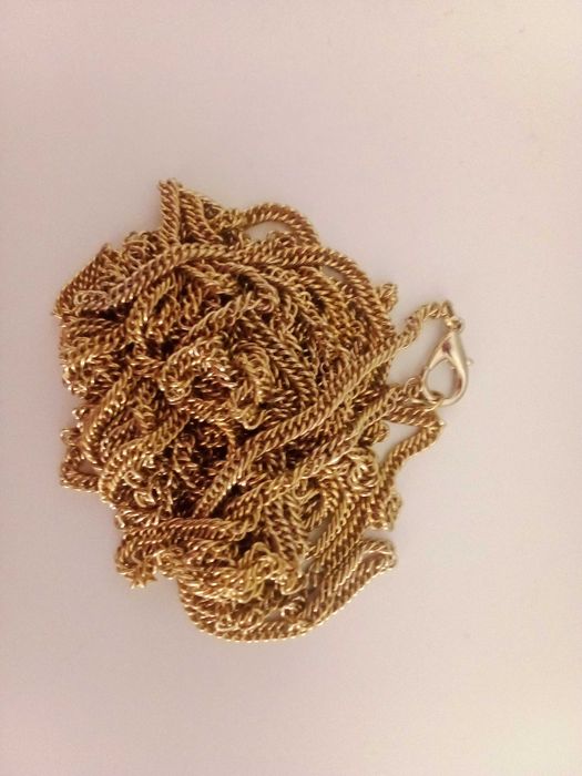 Bordão de metal dourado