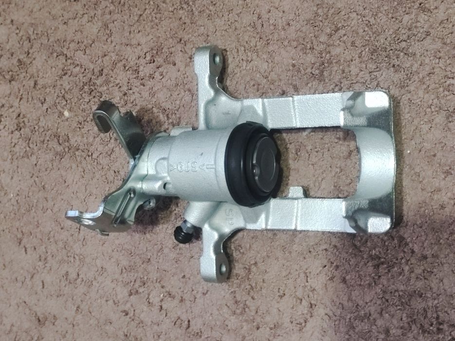 Тормозний задній правий супорт Опель Астра J Зафіра С 95522618