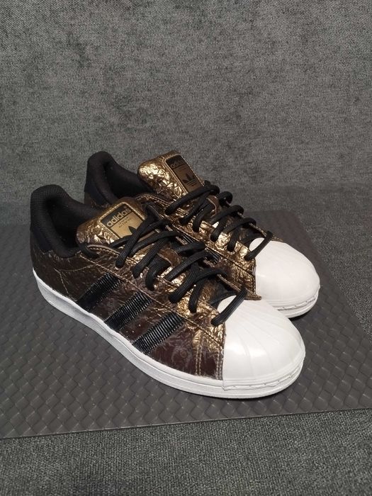 Adidas Superstar metallic foil gold.