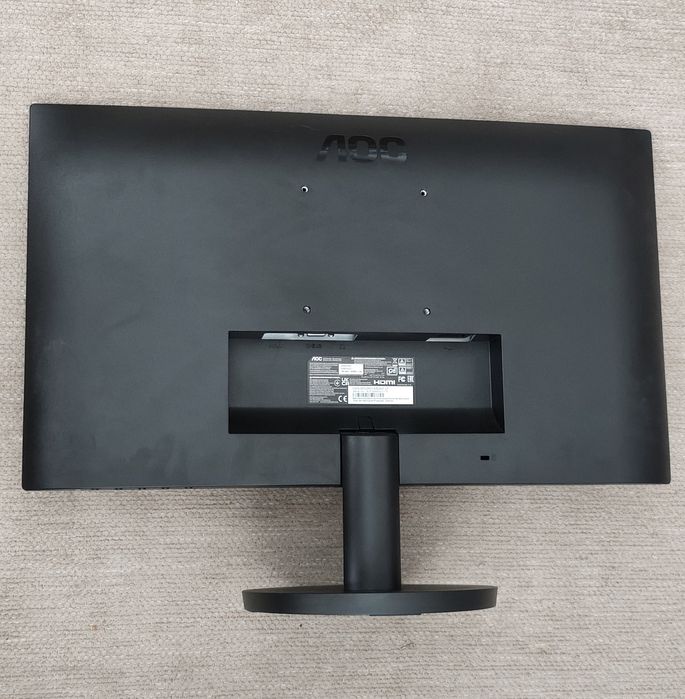 Monitor de secretária da Marca AOC e suporte circular e acabamento em preto