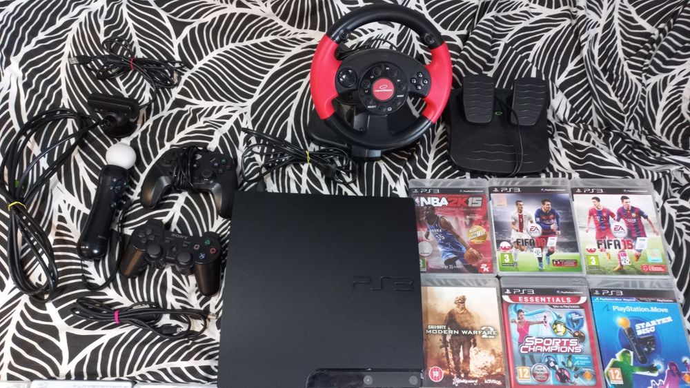 PS3 z 14 płytami i kierownicą gratis!