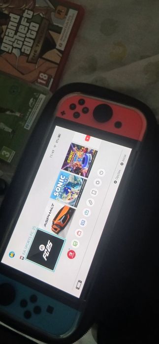 Nintendo Switch OLED (Como Nova) + Garantia + EA Sports FC 25 + Extras
