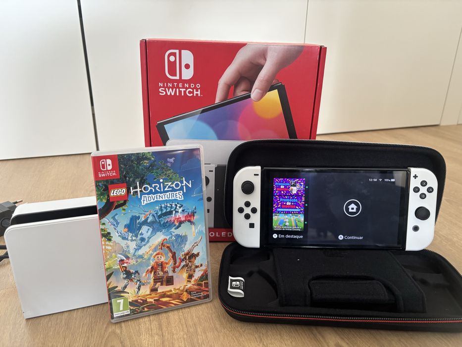 Nintendo switch oled + bolsa de transporte + jogo