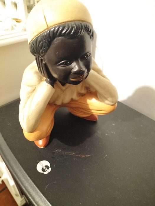 Boneco de porcelana antigo