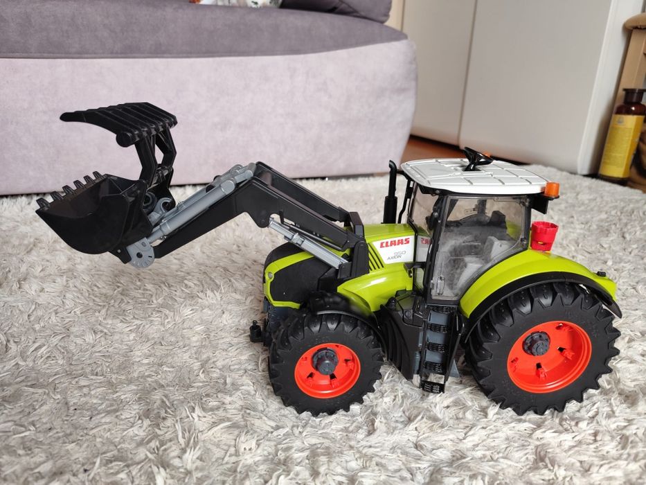 Bruder class axion 950 z ładowaczem jak nowy