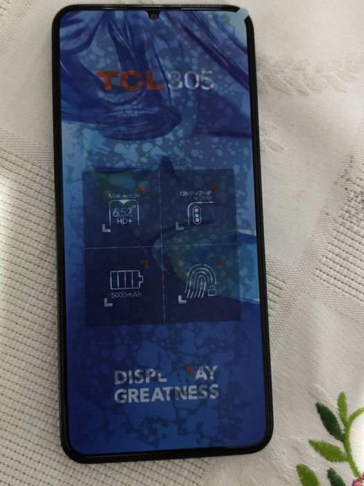 TCL305  com fones incluídos