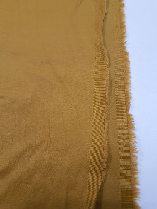 Tkanina musztardowa szer.130 cm.