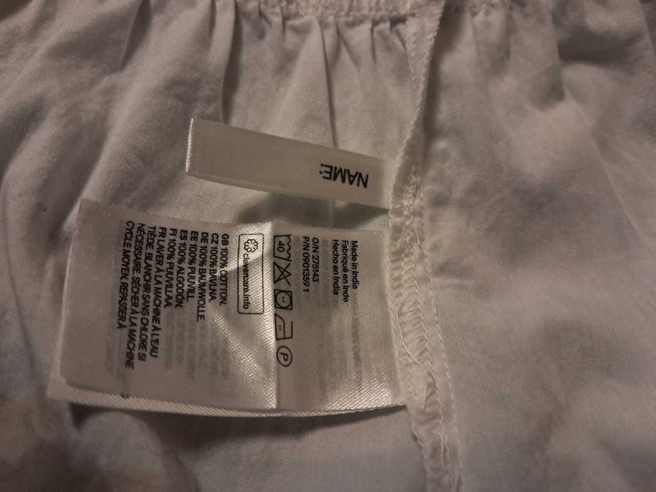Elegancka biała bluzka z baskinką i bufkami h&m