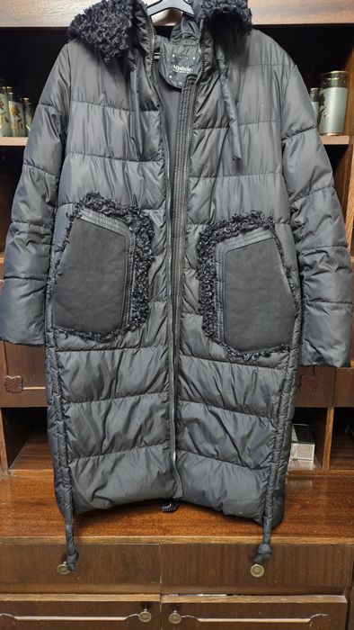 Продам пуховик большого размера.