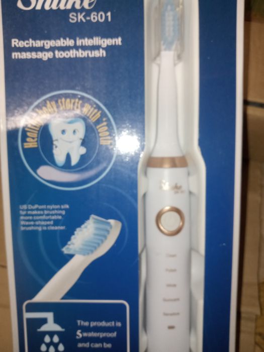 Электрическая зубная щётка