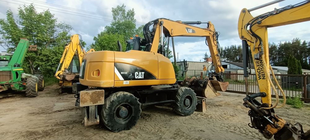 CAT M313D 2014r 9900mtg Sprowadzona + 3 łyżki Rototilt Volvo EW140
