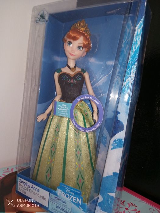 Brinquedo Boneca 30cm Singing Anna Frozen música Love is an open door.