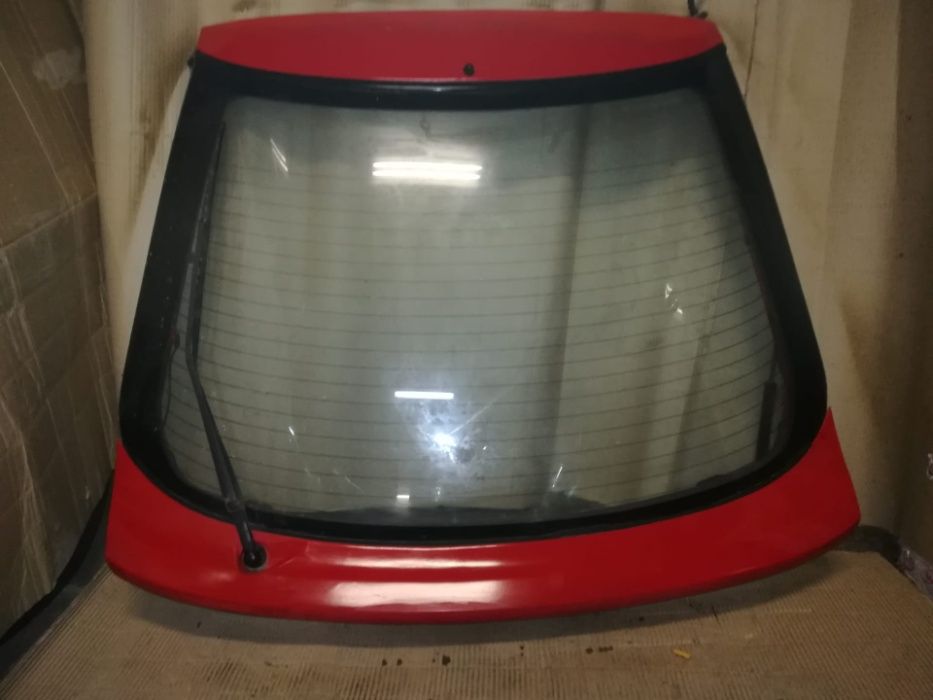 Tampa mala mazda 323