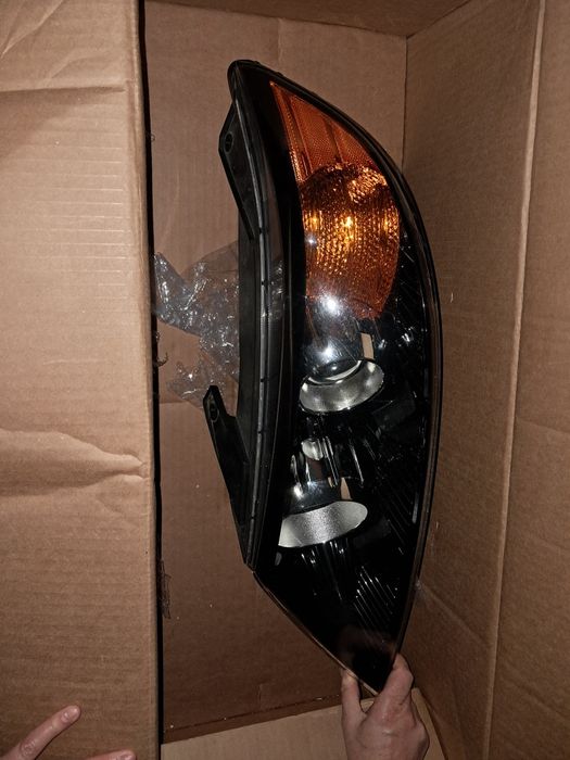 Farol kia sorento 2011