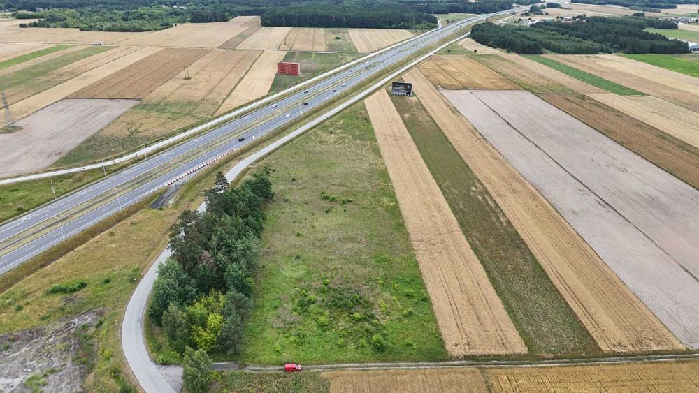Działka inwestycyjna 1,5 ha przy S7 Dobrut, WZ pod halę magazynową, usługi, produkcja, logistyka, sprzedaż bezpośrednia - Widok 5