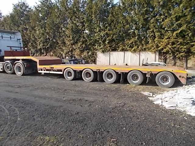 Transport ponad gabaryt maszyn leśnych koparek tiefbett laweta