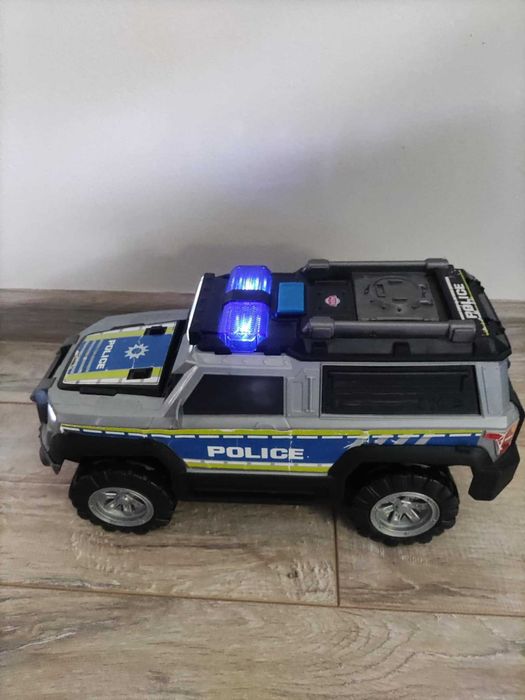 Samochódzik policyjny+monster truck - zabawka swiecacy i wydajacy głos