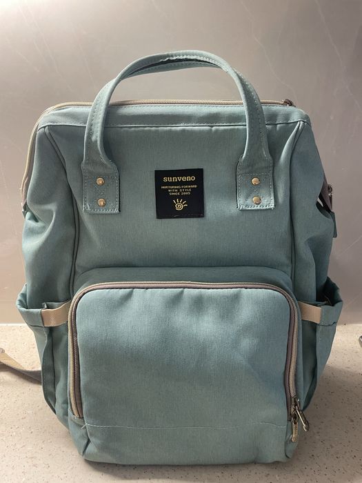 Mochila versátil - muda fraldas como nova!