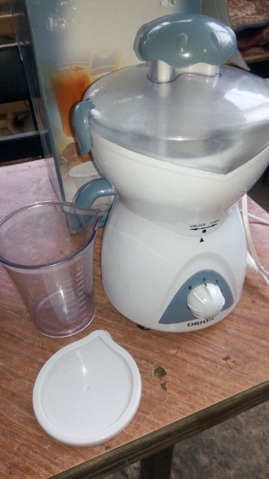 Электро соковыжималка Orion .