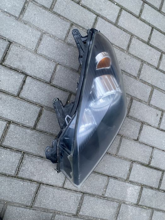 Reflektor lewy przód opel astra H 24451032LH