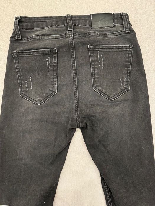 Spodnie jeansy LV z dziurami