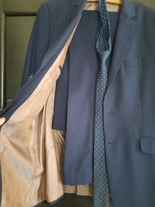 Чоловічий брючний костюм темно синього кольору 48 розміру