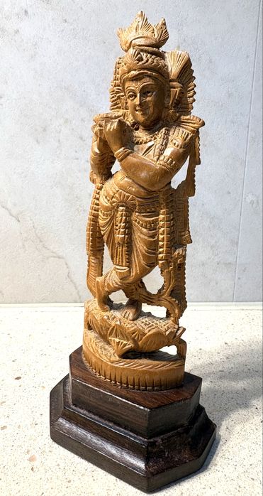 Beautiful vintage Indian wooden sculpture depicting the deity Lord Krishna