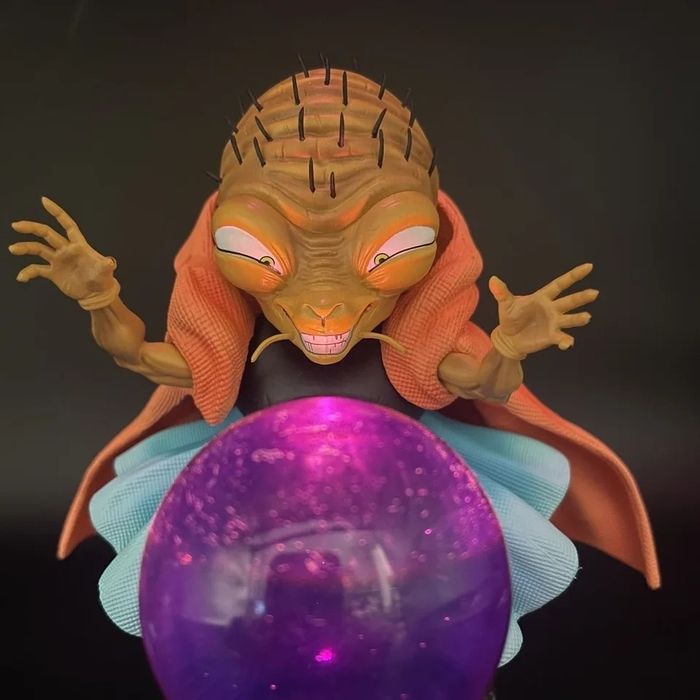 Figura dragon ball com bola de luz