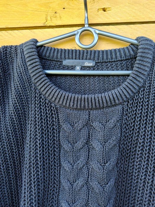 Sweter z warkoczem