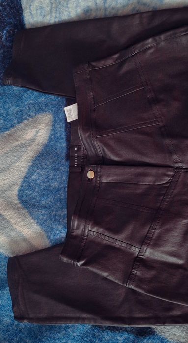 Spodnie woskowane. R.40, Mohito