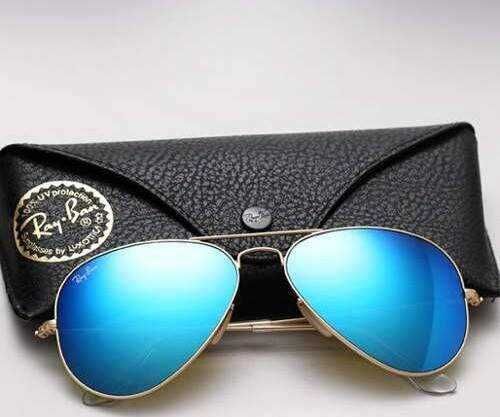 Óculos de sol Ray-Ban Aviador em metal dourado e lente azul espelhada  Loures • OLX Portugal