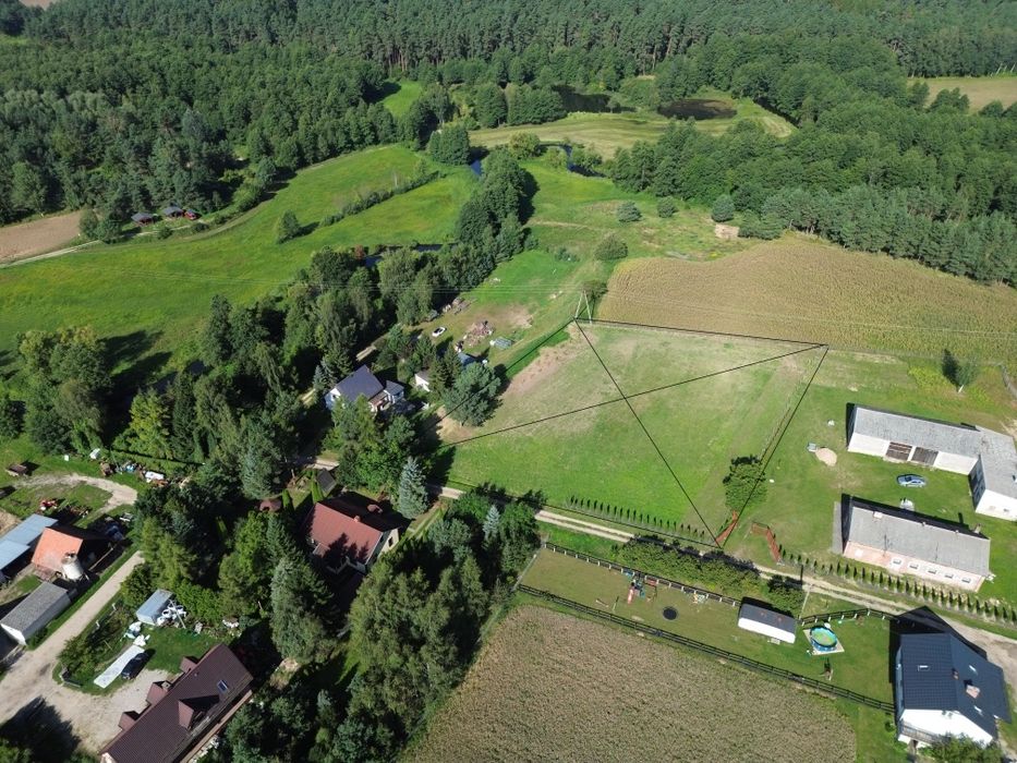 Działka 4000 m² z WZ | Rzeka Wel 100 m | Jezioro 400 m | Ogrodzona