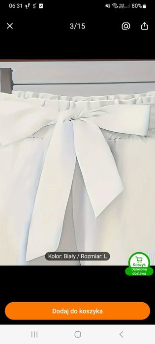 Biale spodnie eleganckie z kokardą L