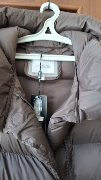 Теплий пуховик , водовідштовхувальна ,м'яка, непродувна плащівка