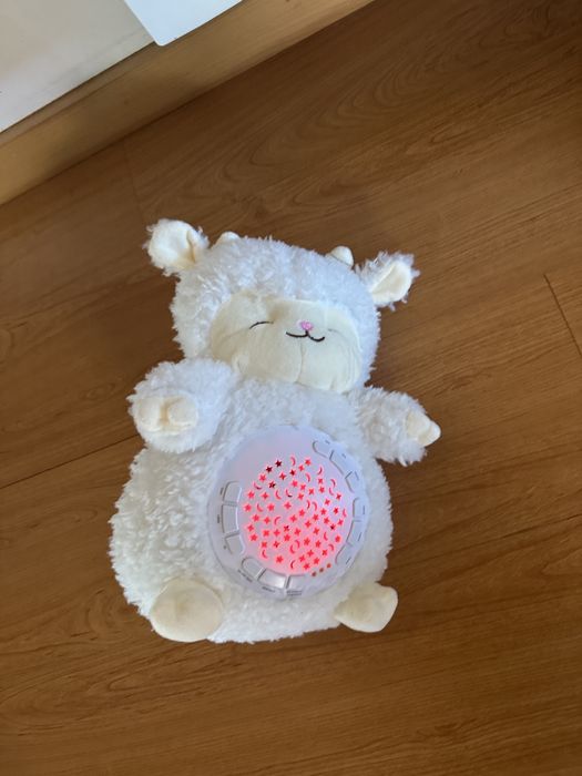 Peluche branco luminoso e com música