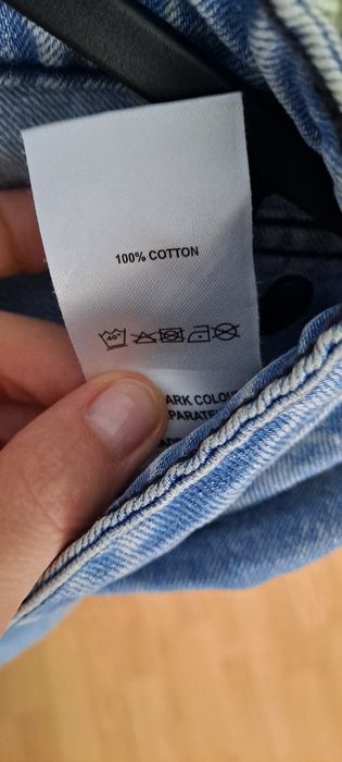Niebieskie spodnie jeansowe z dziurami Missguided  r.36