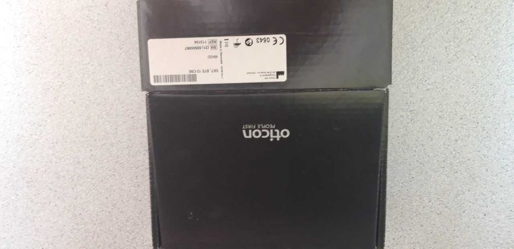 Продам слуховой аппарат Oticon. Новый
