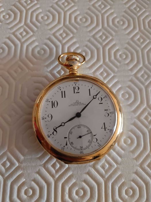 Relógio de bolso Omega,em prata dourada, antigo