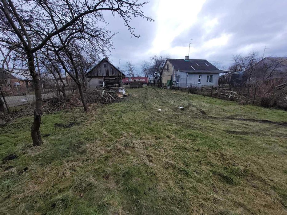 Дерев'яний будинок та земельна ділянка 14 сот. м. Кам'янка-Бузька