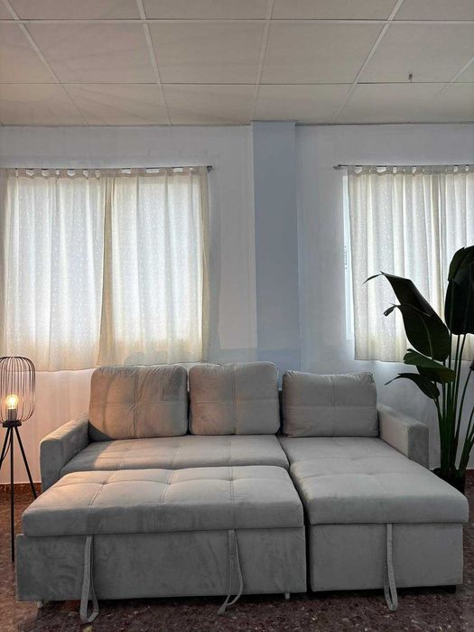 Novo sofá-cama cinzento claro em veludo