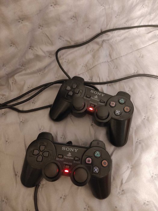 PlayStation 2 + 2 joysticks + 6 jogos