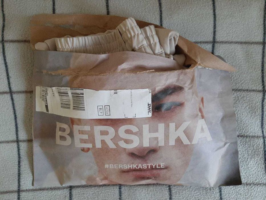 BERSHKA Spodnie męskie tailoring z zakładkami
