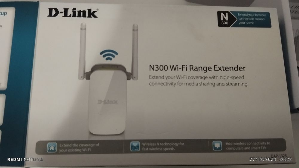 Repetidor d link com a caixa e os manuais de intrucoes.